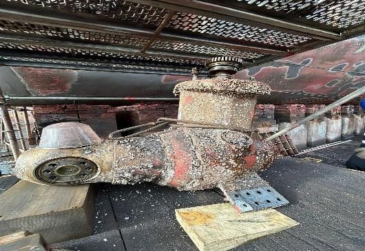 Heavily fouled thruster unit removed from a vessel and placed ashore for overhaul