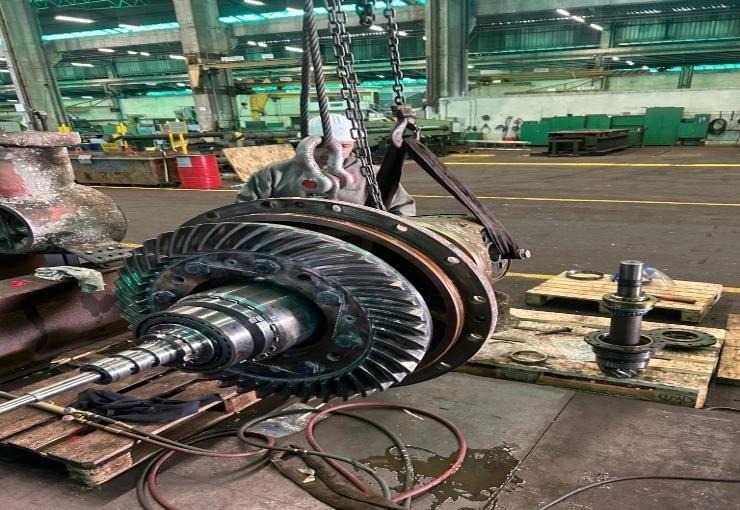 Thruster gearbox with bevel gear being lifted during a workshop overhaul