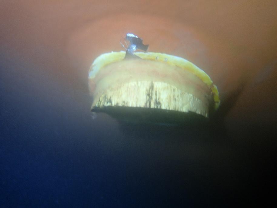 Blanking plug fitted over an opening in a ship's hull underwater